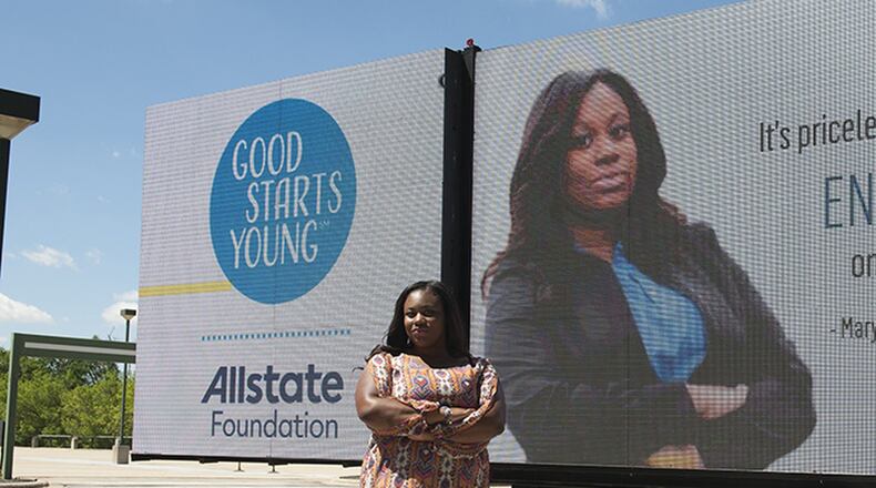 Mary-Pat Hector, 19, poses beside a billboard bearing her image. The Lithonia teen first launched the campaign in metro Atlanta but recently won backing from the Allstate Foundation to post billboards in Chicago. CONTRIBUTED
