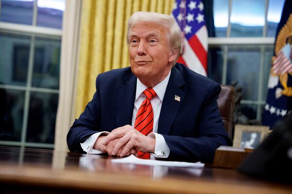 U.S. President Donald Trump reacts to a question from a reporter after signing a series of executive orders on Feb. 10, 2025, in Washington, D.C. (Andrew Harnik/Getty Images/TNS)