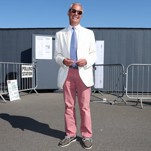 Britain's Reform UK party leader Nigel Farage arrives at a polling station in Walton on the Naze, Thursday, Aug. 13, 2026 to cast his vote for the Clacton on Sea by-election.(AP Photo/Richard Pelham)
