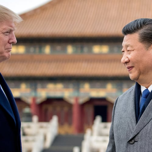 FILE - President Donald Trump, left, and Chinese President Xi Jinping tour the Forbidden City, Nov. 8, 2017, in Beijing, China. (AP Photo/Andrew Harnik, File)