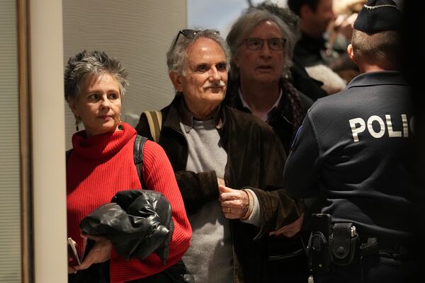 Actor Anouk Grinberg, left, enters the courtroom as actor Gerard Depardieu faces trial for the alleged sexual assaults of two women on a film set in 2021, Monday, March 24, 2025 in Paris. (AP Photo/Aurelien Morissard)