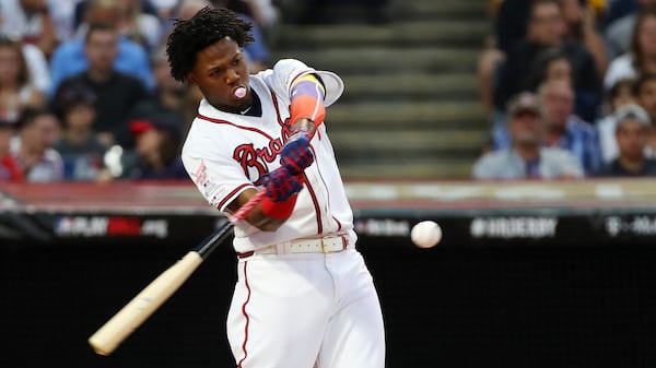 A much younger Ronald Acuña Jr. multitasks during the 2019 Home Run Derby in Cleveland.