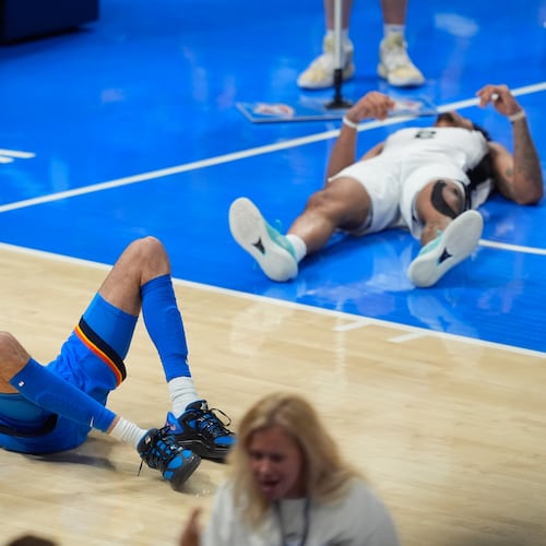 Oklahoma City Thunder center Chet Holmgren (7) and San Antonio Spurs guard Dylan Harper (2) react after a foul call during the second half of Game 2 in the Western Conference finals NBA basketball playoffs series Wednesday, May 20, 2026, in Oklahoma City. (AP Photo/Tony Gutierrez)