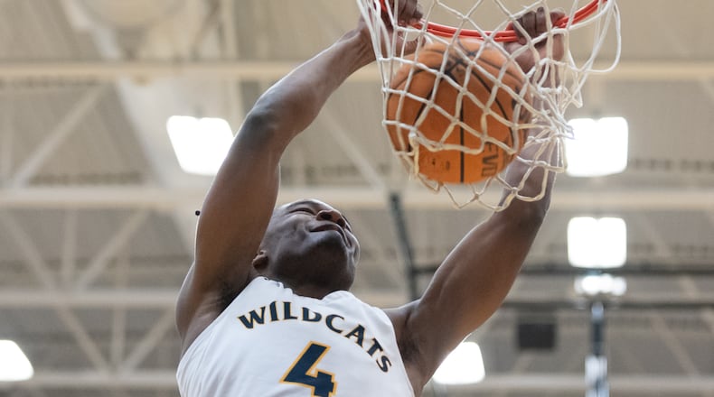 Isaiah Collier, point guard for Wheeler, makes a slam dunk at the Wheeler v Milton high school basketball round one playoffs Wednesday night, February 22, 2023