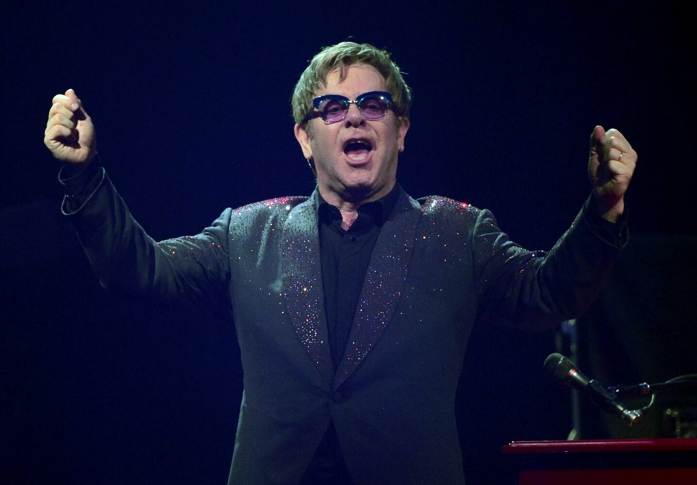 Elton John's son Elijah. Elton John is the godfather of...