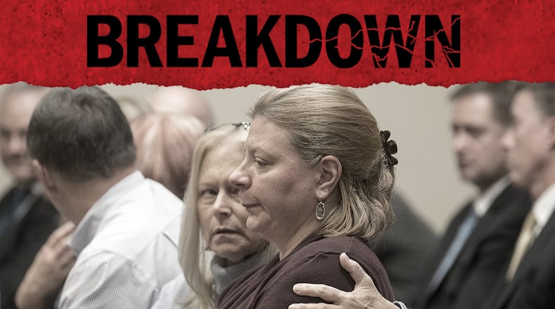 Katherine Olsen, right, wife of former DeKalb County Police officer Robert Olsen, is consoled after her husband was sentenced to 20 years, with a mandatory of 12 years to serve, on Nov. 1, 2019. (Alyssa Pointer/Atlanta Journal Constitution)