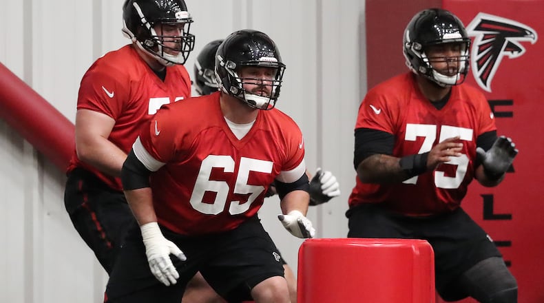May 22, 2018 Flowery Branch: Atlanta Falcons new offensive guard Brandon Fusco (left) runs a drill with guard Jamil Douglas during organized team activities on Tuesday, May 22, 2018, in Flowery Branch. Curtis Compton/ccompton@ajc.com
