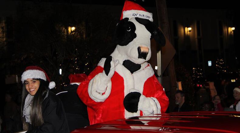 A visitor cruises a past Canton Optimist Club Christmas Parade. This year’s event, the 31st edition, is set for the evening of Saturday, Dec. 1. CANTON OPTIMIST CLUB via Facebook
