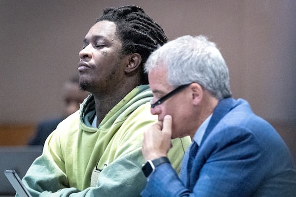 Atlanta rapper Young Thug listens to the judge at the Fulton County Courthouse during jury selection in the “Young Slime Life” gang case with his defense attorney Brian Steel in Atlanta Tuesday, September 12, 2023.  (Steve Schaefer/steve.schaefer@ajc.com)