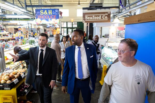 Atlanta Mayor Andre Dickens (center) tours the Municipal Market in Atlanta on Friday, October 18, 2024. (Arvin Temkar/AJC)