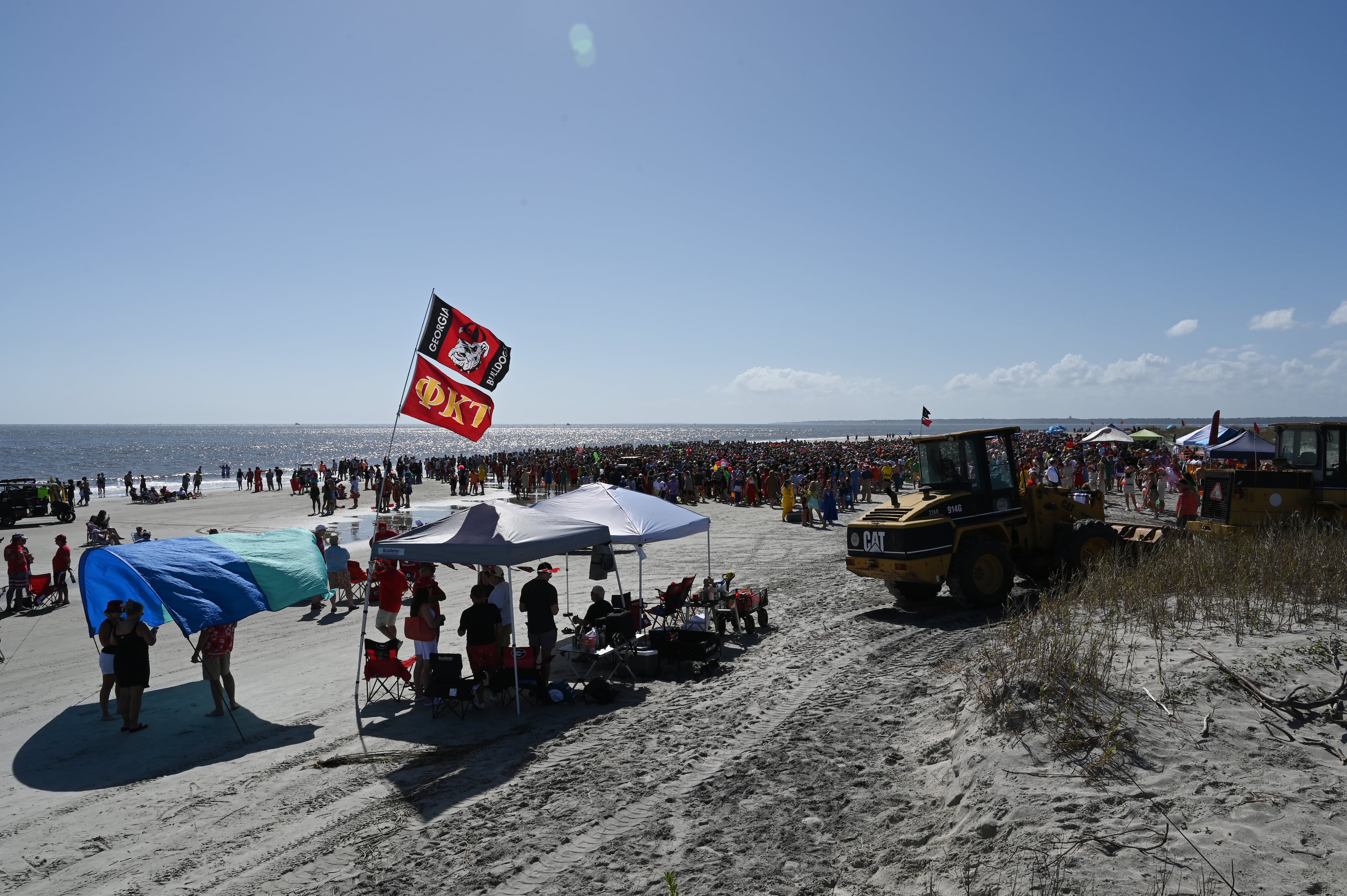 Thousands of UGA students gather during the annual “Frat Beach” party for the weekend of the Georgia-Florida football game on St. Simons Island, Friday, November 1, 2024. On the weekend of the Georgia-Florida football game, St. Simons Island’s East Beach becomes “Frat Beach,” an open-air party teeming with thousands of college students. (Hyosub Shin / AJC)