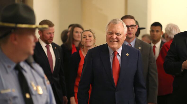 Gov. Nathan Deal walks toward the elevator after speaking to the Senate and House during his final Sine Die.  PHOTO / JASON GETZ