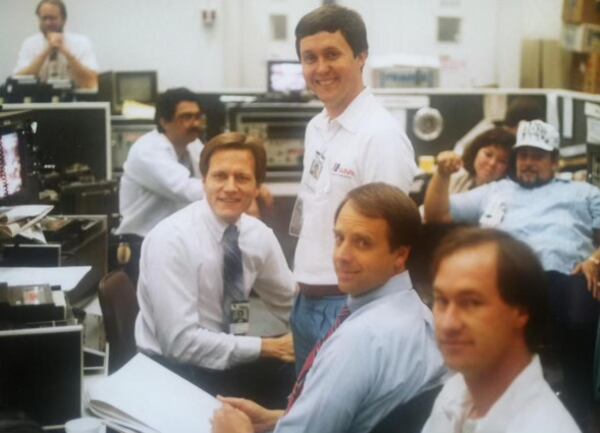 Jon Shirek (left) with John Pruitt (seated, center) at 11Alive in the newsroom sometime in the 1980s. (CONTRIBUTED)