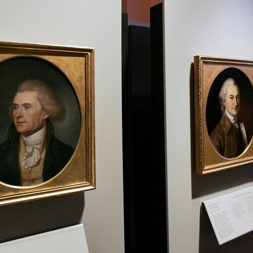 FILE - Portraits of a red-headed Thomas Jefferson, left, and John Dickinson, right, by by Charles Willson Peale are seen at the refurbished Second Bank of the United States in Philadelphia on Nov. 26, 2004. (AP Photo/Jacqueline Larma, File)