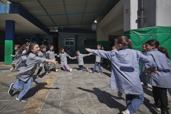Students play in the courtyard of a primary school run by UNRWA for Palestinian refugees at the Mar Elias refugee camp in Beirut, Lebanon, Monday, June 2, 2025. (AP Photo/Hassan Ammar)