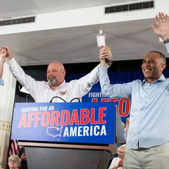 Pennsylvania Gov. Josh Shapiro, left, Democratic congressional candidate Bob Brooks, center, and U.S. House Democratic Leader Hakeem Jeffries raise their hands during a campaign event for Brooks ahead of the midterm elections at a Steelworkers Union Hall in Bethlehem, Pa., Sunday, July 26, 2026. (AP Photo/Erin Blewett)