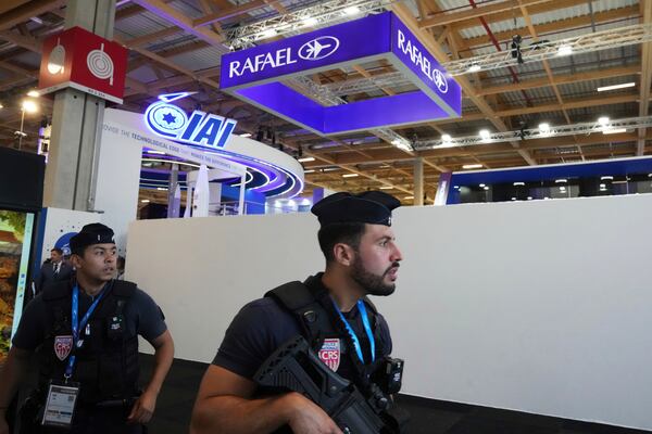 Riot police officers patrol by the blocked Rafael stand and Israeli pavilions at the Paris Air Show , Monday, June 16, 2025 in Le Bourget, north of Paris. (AP Photo/Michel Euler)