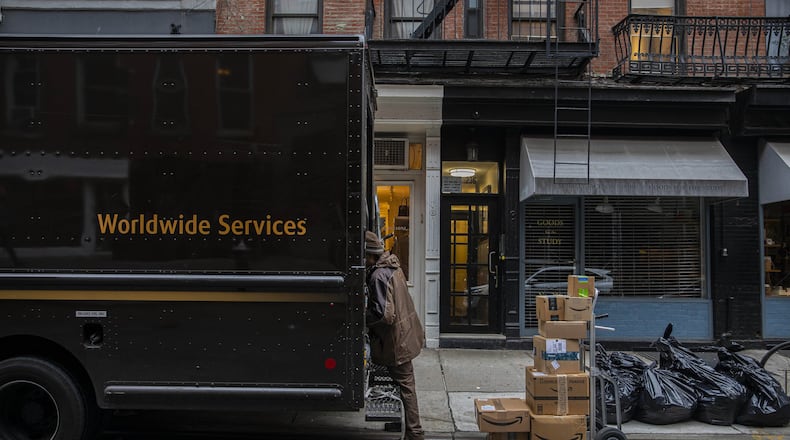 A UPS delivery worker in New York, March 19, 2020. Retailers and companies in the food and medical supply chain, which are seeing demand soar, are recruiting workers directly from employers like hotels and restaurants, which have largely been shut down by the pandemic and laid off staffs en masse. (Hiroko Masuike/The New York Times)