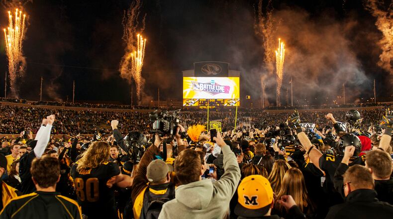 Missouri fans rush the field and celebrate after the team's 21-14 victory over Arkansas in an NCAA college football game Friday, Nov. 28, 2014, in Columbia, Mo. Missouri won 21-14. (AP Photo/L.G. Patterson) Missouri players and fans celebrate a win and the SEC East title. (AP photo)