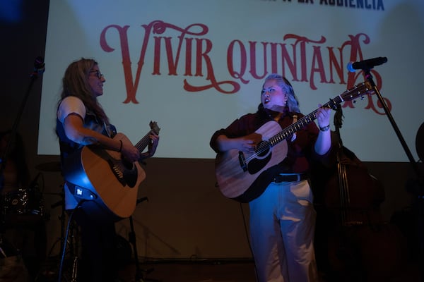 Mexican corridos singer Vivir Quintana, right, performs her new album, about violence against women, in Mexico City, Thursday, April 24, 2025. (AP Photo/Aurea Del Rosario)