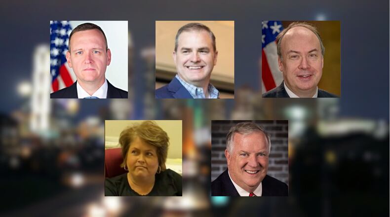 Former Trump campaign official Mike Roman (top left), state Sen. Shawn Still, former senior Department of Justice official Jeffrey Clark, (2nd row) former elections supervisor for Coffee County Misty Hampton, and Alpharetta lawyer Bob Cheeley surrendered to the Fulton County jail for booking after midnight Friday, Aug. 25, 2023.