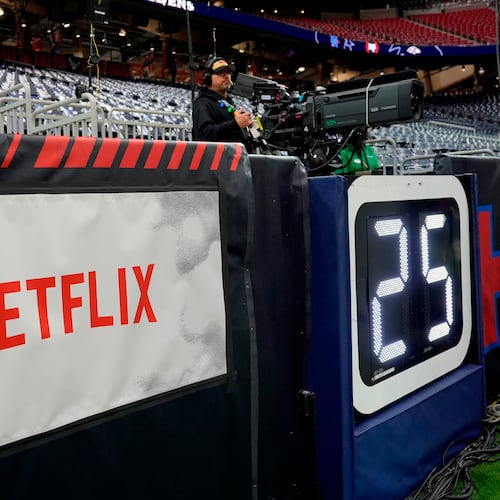 FILE - A Netflix banner is seen before an NFL football game between the Houston Texans and the Baltimore Ravens, Dec. 25, 2024, in Houston. (AP Photo/David J. Phillip, File)