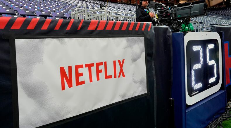 FILE - A Netflix banner is seen before an NFL football game between the Houston Texans and the Baltimore Ravens, Dec. 25, 2024, in Houston. (AP Photo/David J. Phillip, File)
