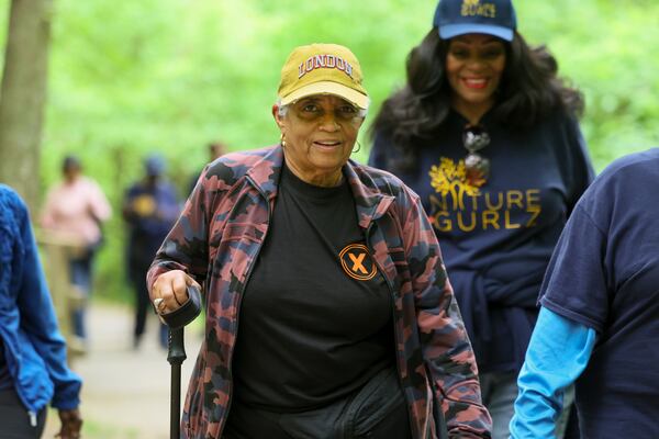 Former Atlanta Mayor Shirley Franklin (center) and other members of the Nature Gurlz walk along the trail at Cascade Springs Nature Preserve on April 22, 2025, in Atlanta. (Jason Getz/AJC)