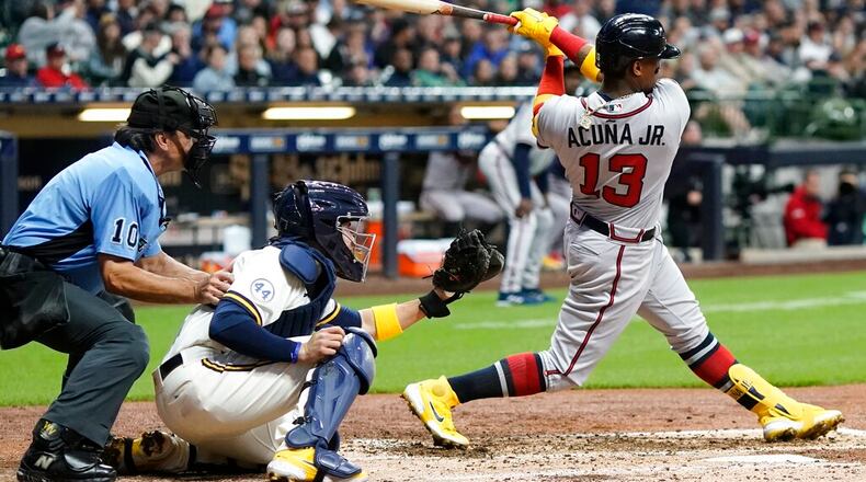 Atlanta Braves' Ronald Acuna Jr. hits an RBI single during the fifth inning of a baseball game against the Milwaukee Brewers Tuesday, May 17, 2022, in Milwaukee. (AP Photo/Morry Gash)