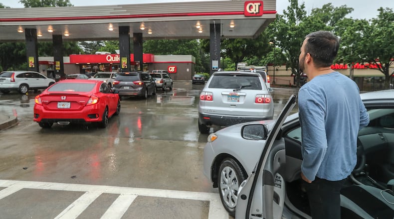 Mirweis Jalalzai moved here from Afghanistan 5 years ago and never saw his former country's gas stations run out of gas before. Lines formed at the QuikTrip located at Briarcliff Road and North Druid Hills in DeKalb County on Wednesday morning, May 12, 2021 as gas continued to flow at the station there until noon and then ran out. (John Spink / John.Spink@ajc.com)