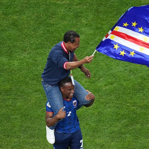 Cape Verde head coach Bubista waves a flag while being carried on the shoulder of Jovane Cabral (7) during the World Cup Group H soccer match between Cape Verde and Saudi Arabia in Houston, Friday, June 26, 2026. (AP Photo/Eric Gay)