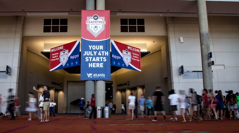 People mill around outside the Peachtree Health and Fitness Expo at the Georgia World Congress Center in Atlanta on Saturday, July 2, 2016. STEVE SCHAEFER / SPECIAL TO THE AJC