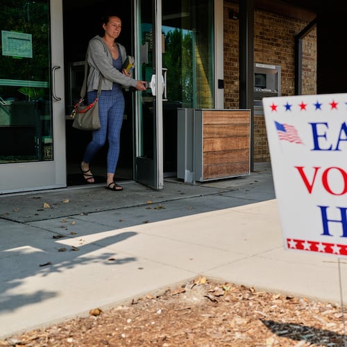 A voter walks out after voting at a polling place, Tuesday, July 28, 2026, in Milwaukee. (AP Photo/Nam Y. Huh)