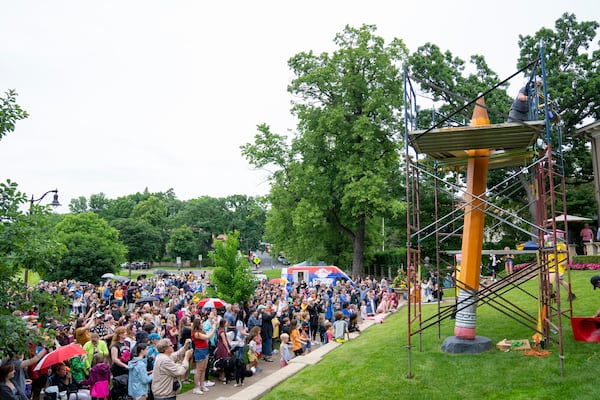 FILE - Hundreds of people gather to watch the 3rd Annual Sharpening of the Lake of the Isles Pencil in Minneapolis on June 15, 2024. (Alex Kormann/Star Tribune via AP)