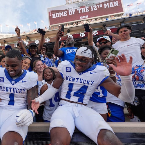 Kentucky's CJ Baxter Jr. (1) and Ty Bryant (14) celebrate after an NCAA college football game against Texas A&M Saturday, Sept. 19, 2026, in College Station, Texas. (AP Photo/David J. Phillip)