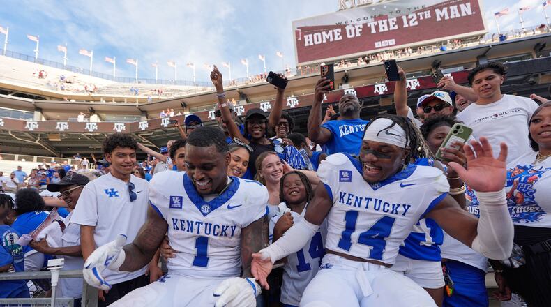 Kentucky's CJ Baxter Jr. (1) and Ty Bryant (14) celebrate after an NCAA college football game against Texas A&M Saturday, Sept. 19, 2026, in College Station, Texas. (AP Photo/David J. Phillip)