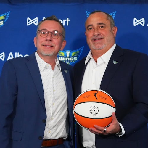 Dallas Wings general manager Curt Miller, left, poses for photographers with Jose Fernandez, right, during a news conference introducing Fernandez as the WNBA basketball team's new head coach, Thursday, Nov. 6, 2025, in Dallas. (AP Photo/Julio Cortez)