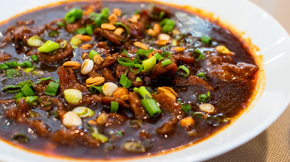 The spicy peppercorn boiled beef/tofu at Masterpiece hits you with a combination punch of spiciness, from hot peppers, chili oil and numbing Sichuan peppercorns. CONTRIBUTED BY HENRI HOLLIS