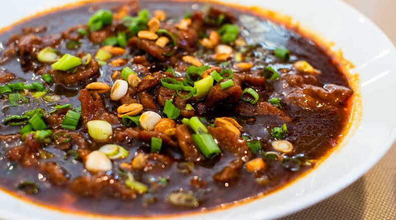 The spicy peppercorn boiled beef/tofu at Masterpiece hits you with a combination punch of spiciness, from hot peppers, chili oil and numbing Sichuan peppercorns. CONTRIBUTED BY HENRI HOLLIS