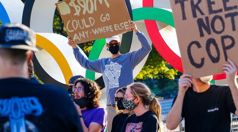 Protestors marched through downtown Atlanta to the World of Coca-Cola on Friday, Sept 3, 2021 to demonstrate against the proposed police training facility. (Jenni Girtman for The Atlanta Journal-Constitution)