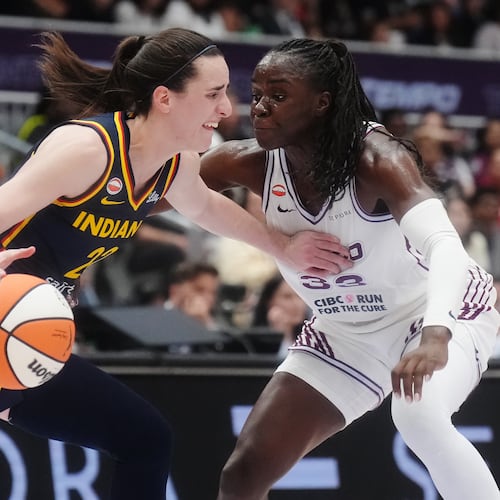 Indiana Fever's Caitlin Clark (22) drives as Toronto Tempo's Ornella Bankole (33) defends during first half WNBA basketball action in Toronto on Friday, Sept. 18, 2026. (Nathan Denette/The Canadian Press via AP)