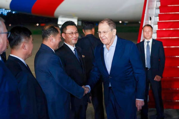 In this photo provided by the Russian Foreign Ministry Press Service, Russian Foreign Minister Sergey Lavrov, second right, shakes hands with North Korean officials upon his arrival at an airport outside Pyongyang, North Korea, on Friday, July 11, 2025. (Russian Foreign Ministry Press Service via AP)