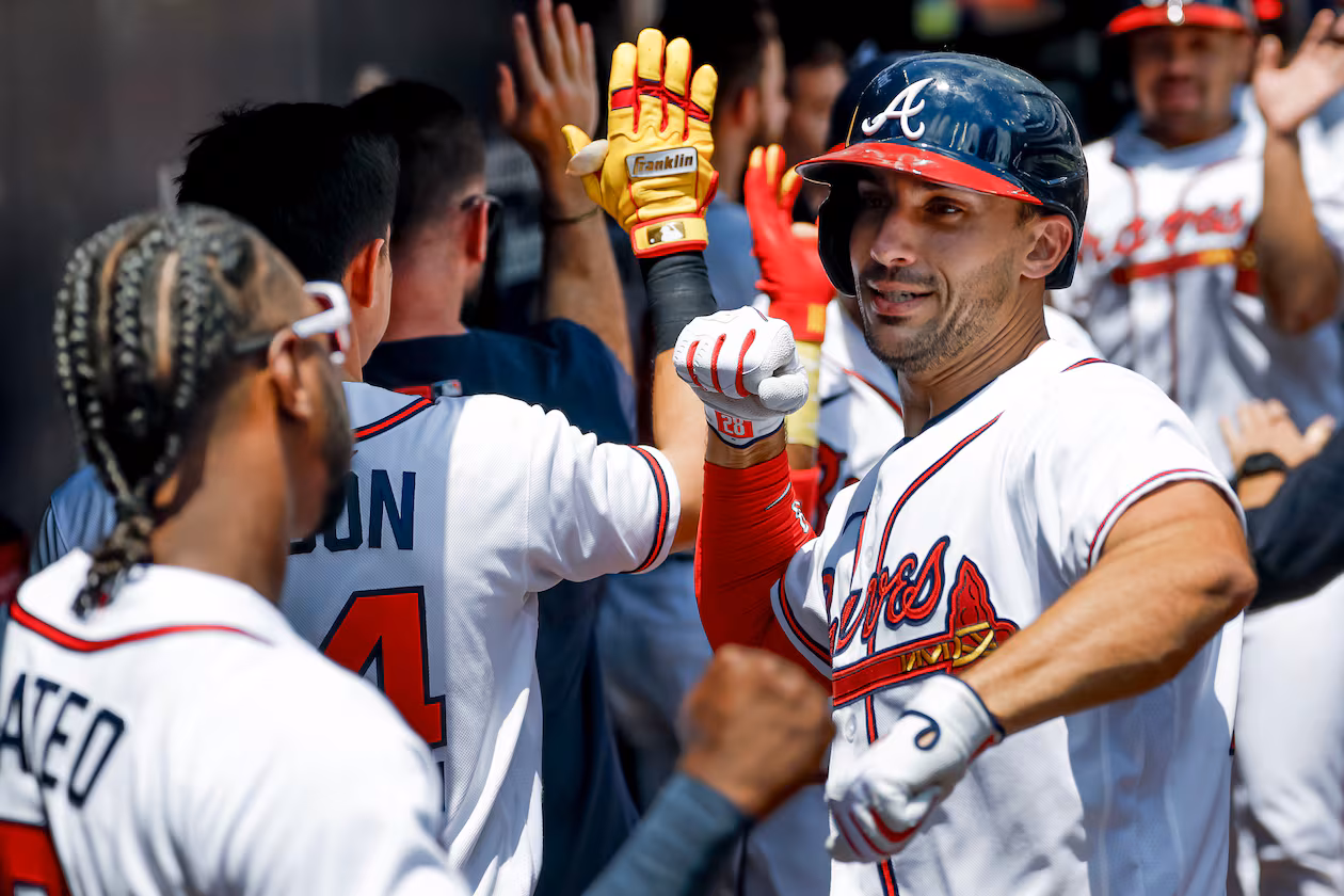 Atlanta Braves' Matt Olson, right, celebrates in the dugout with Jorge Mateo, left, after hitting a three-run home run against the Philadelphia Phillies during the first inning of a baseball game, Sunday, April 26, 2026, in Atlanta. (AP Photo/Erik S. Lesser)