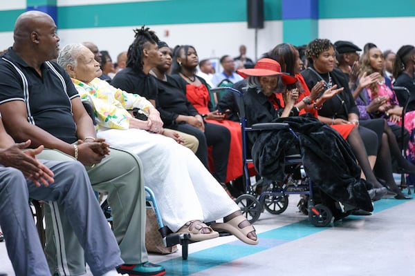 Viola "Mother" Ford Fletcher, 110 years of age (yellow) is one of the final two survivors sits across the aisle from the other survivor Lessie Benningfield "Mother" Randle (red hat), 109 years old, as they listen during the Legacy event for the Tulsa Race Massacre on Sunday, June 1, 2025, at Greenwood Cultural Center in Tulsa, Okla. (AP Photo/Joey Johnson)