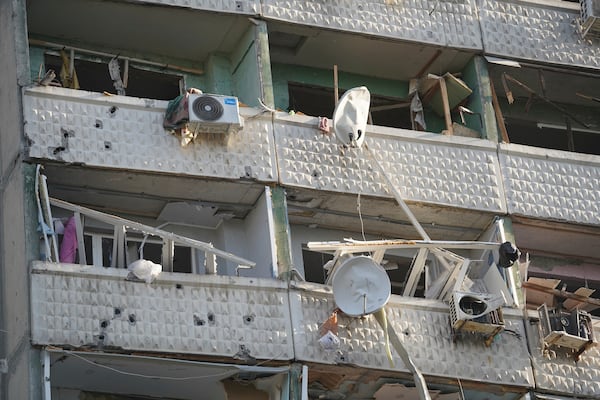 A residential building damaged by a Russian strike in Kharkiv, Ukraine, Friday April 18, 2025. (AP Photo/Andrii Marienko)
