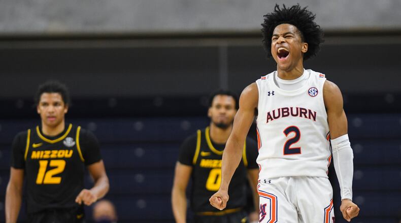 Auburn guard Sharife Cooper (2) celebrates a Missouri turnover in the final seconds of an NCAA college basketball game Tuesday, Jan. 26, 2021, in Auburn, Ala.