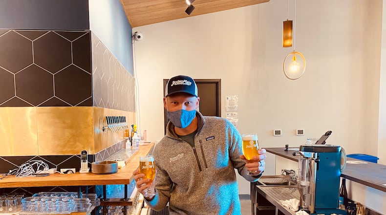 CEO and Director of Brewery Operations Craig Mycoskie, shown in the taproom at Round Trip Brewing, previously worked for breweries in Colorado and Texas. Bob Townsend for The AJC