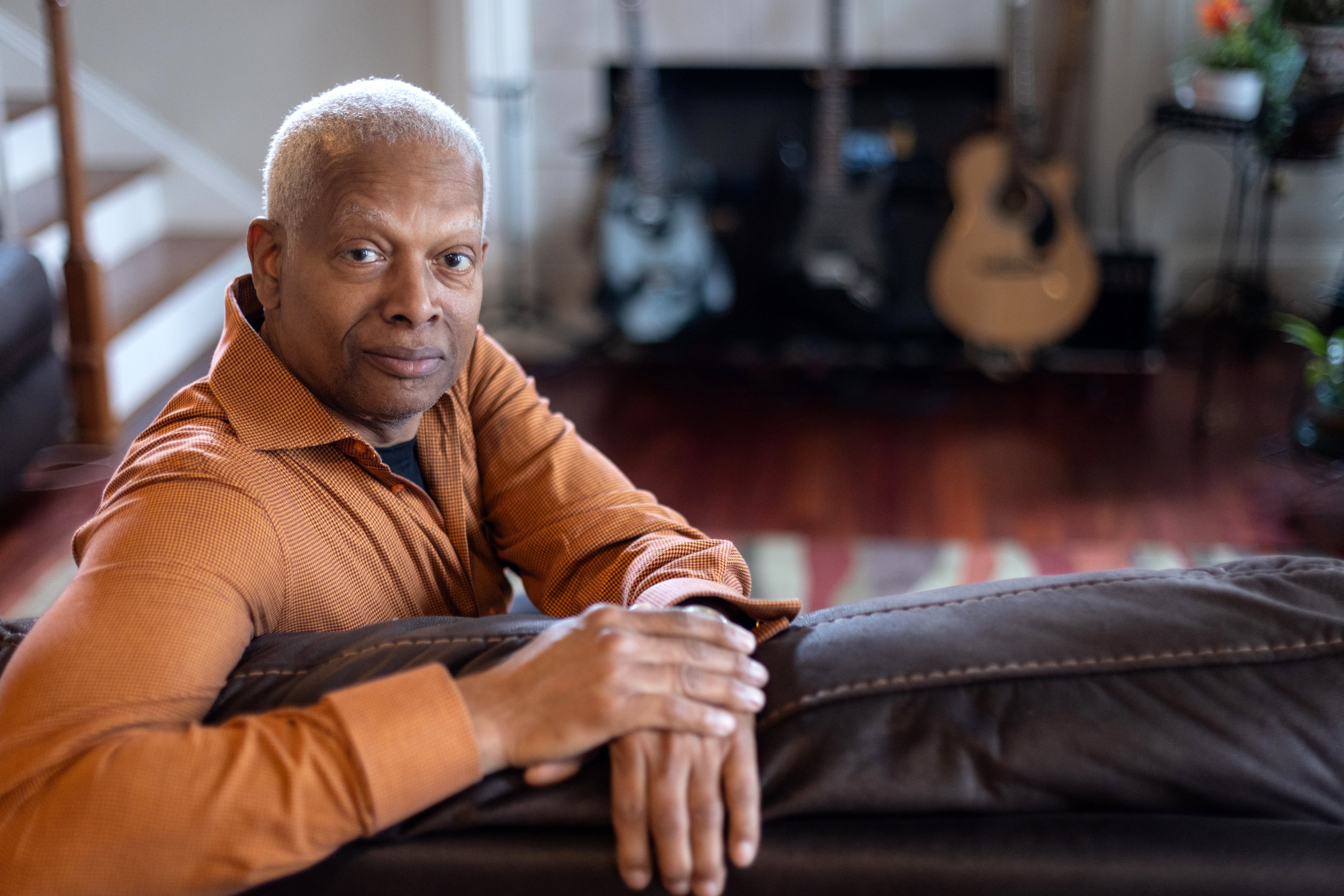 U.S. Rep Hank Johnson posed for a photograph last year in his Lithonia home with some of his guitars.