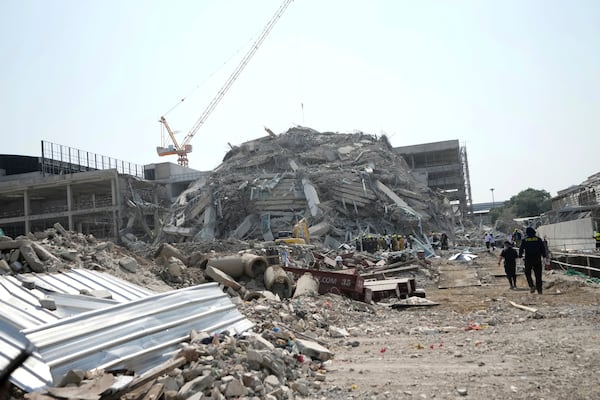 Rescuers work at the site of a high-rise building under construction that collapsed after a 7.7 magnitude earthquake in Bangkok, Thailand, Friday, March 28, 2025. (AP Photo/Sakchai Lalit)