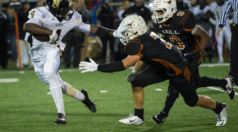 Sprayberry's Trey Sermon (left) runs against Kell in 2014.